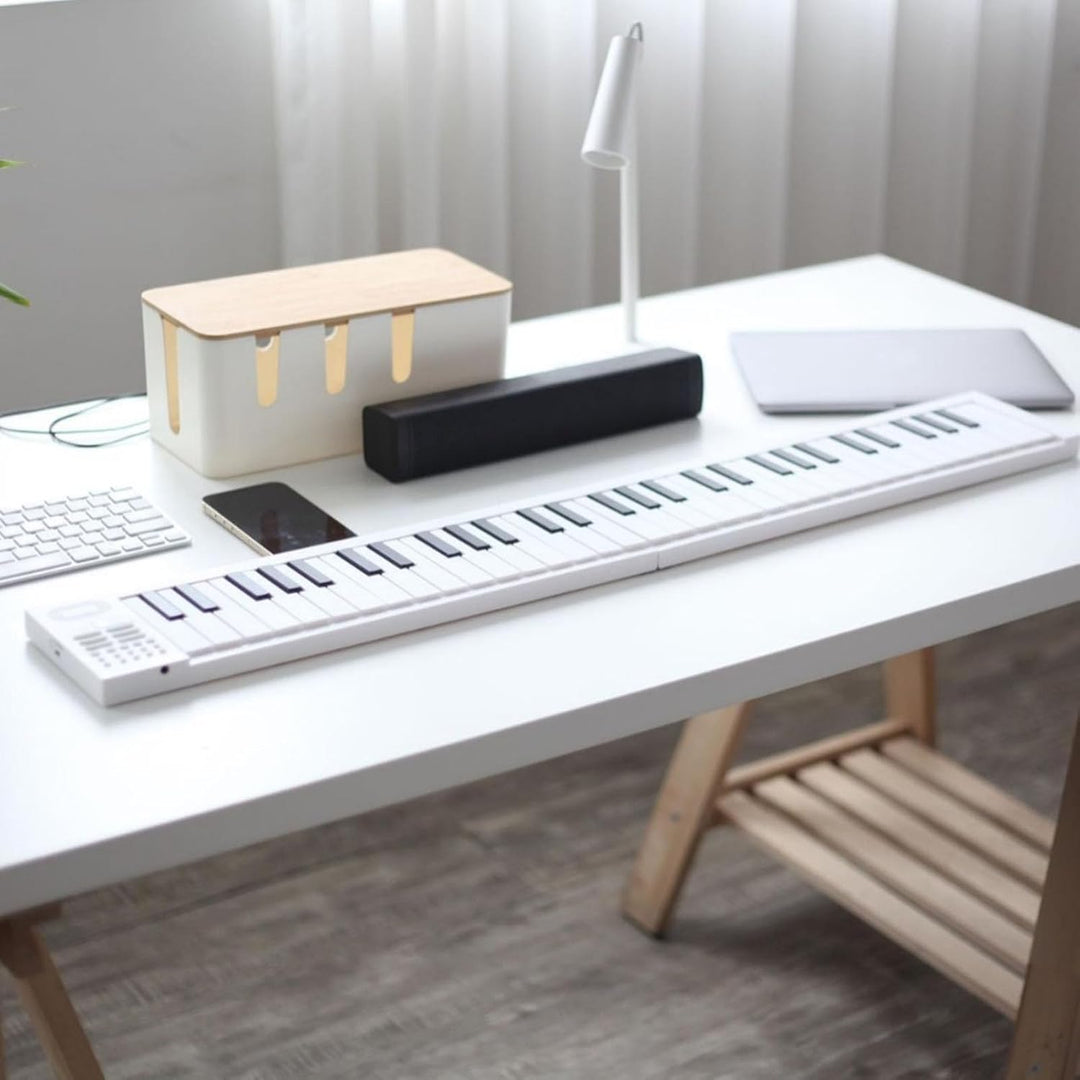 Kompaktes faltbares 61-Tasten Digitalpiano Meliora, zusammengeklappt für einfachen Transport & Reise.