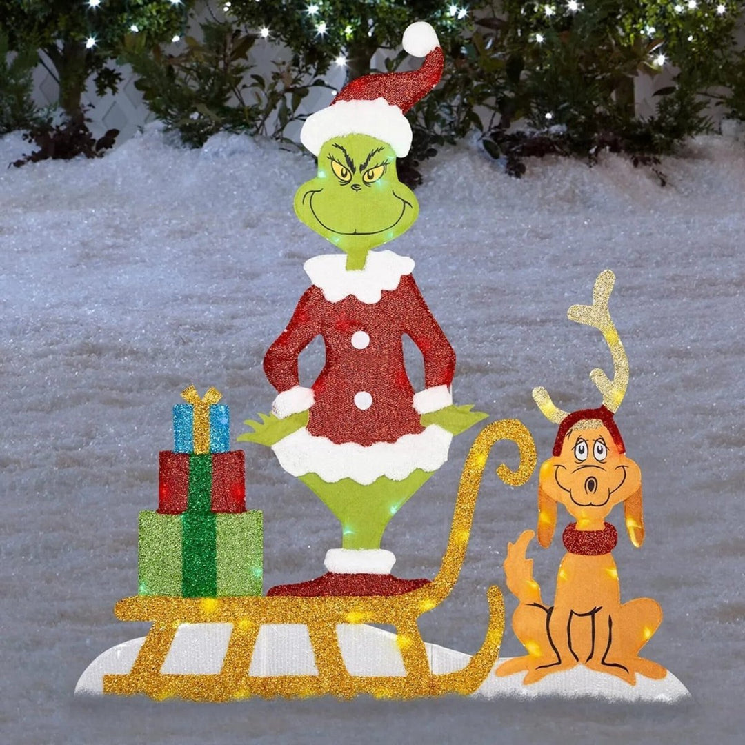 Auffällige Grinch Gartendekoration mit LED-Lichtern. Charmante Weihnachts- und Winterdeko im Außenbereich.