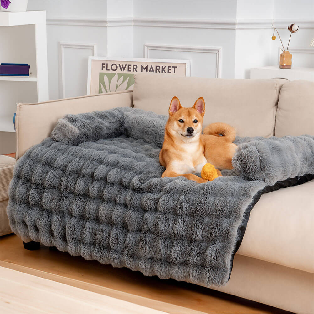 Gemütliches Kuschelbett für Hunde, flauschig und beruhigend, mit integriertem Sofaschutz.