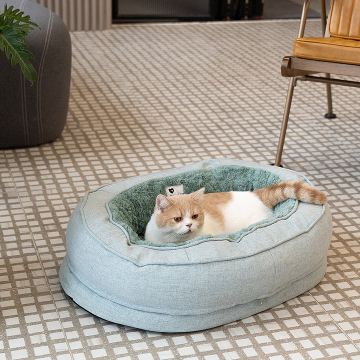 Flauschiges orthopädisches Hundebett in Donutform für tiefen Schlaf & Komfort.