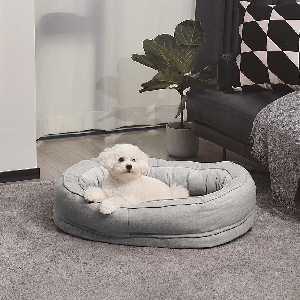 Entspannendes Hundebett Donut, flauschig und waschbar, fördert gesunden Schlaf.
