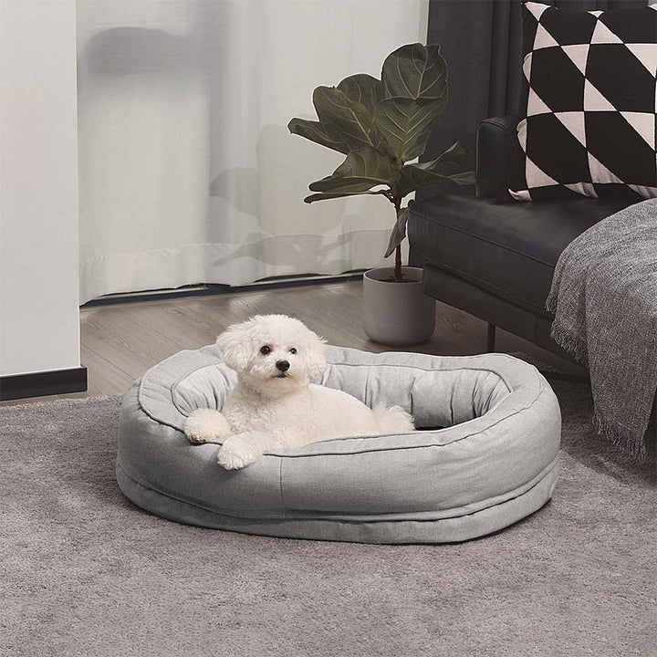 Entspannendes Hundebett Donut, flauschig und waschbar, fördert gesunden Schlaf.
