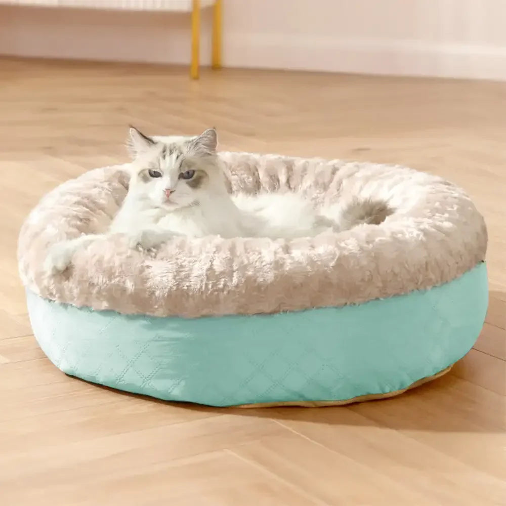 Gemütliches Kunstpelz Katzenbett in Donut-Form, ideal zum Kuscheln und Schlafen. Waschbar & warm.