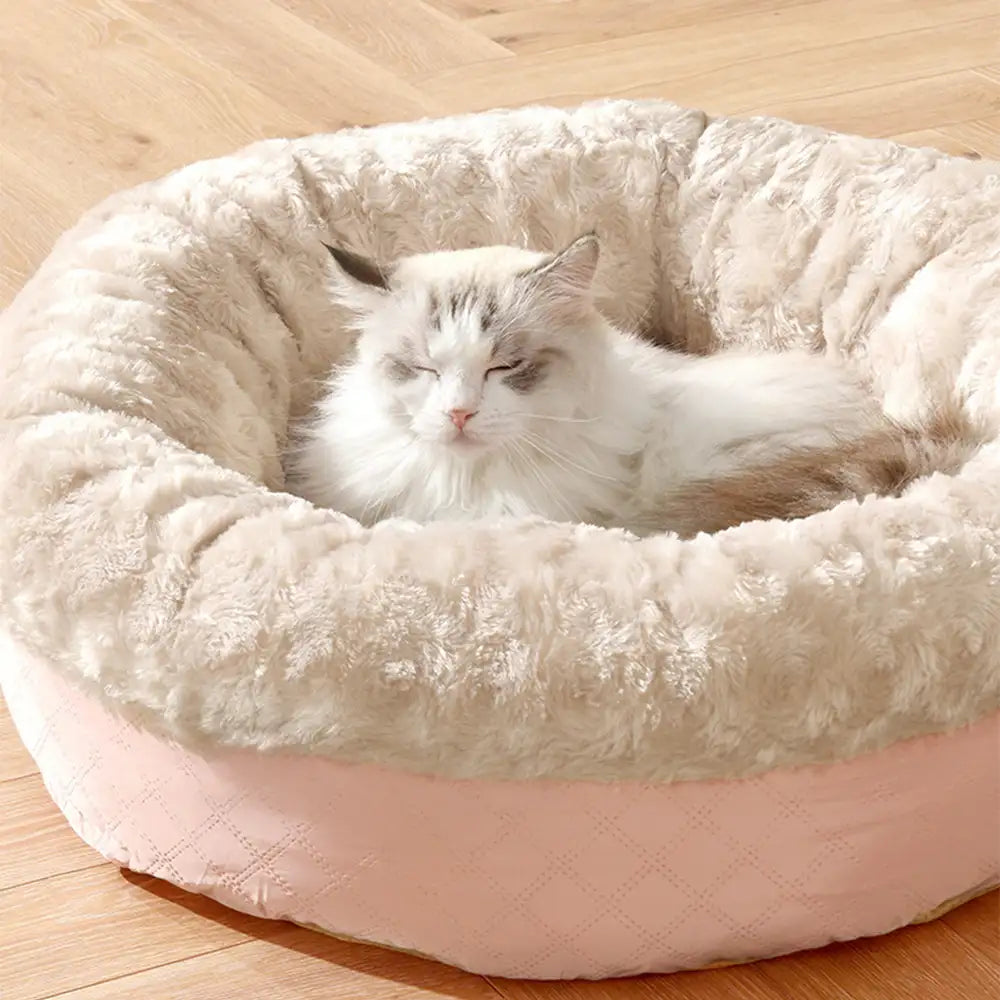 Weiches, rundes Tierbett aus Kunstpelz, perfekt für Hunde & Katzen. Donut-Design für Geborgenheit.