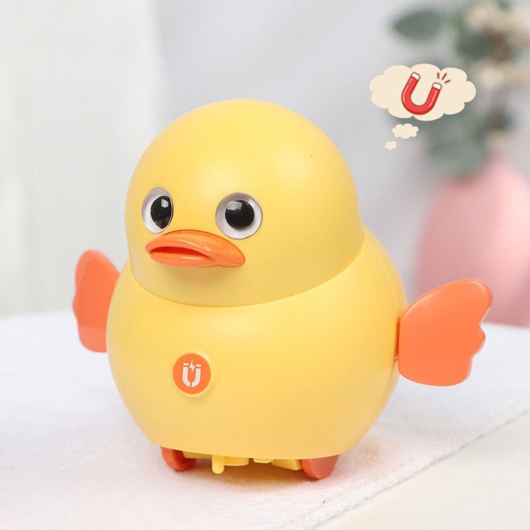 Geschenkidee: Watschelndes Enten-Babyspielzeug, gelb & rosa, fördert spielerisch die Entwicklung.