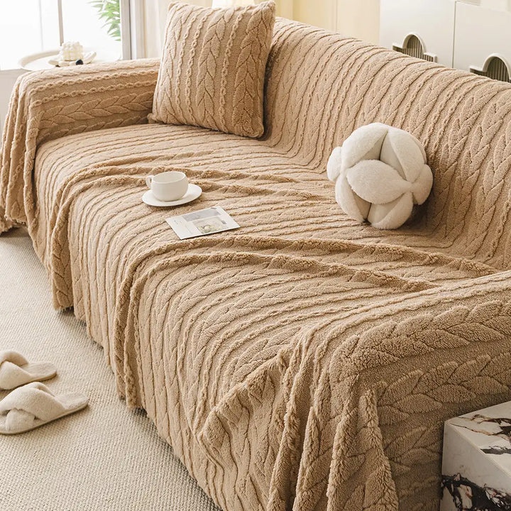 Hochwertiger Fleece-Sofaschutz in elegantem Grau, ein Deko-Highlight für Ihr Wohnzimmer.