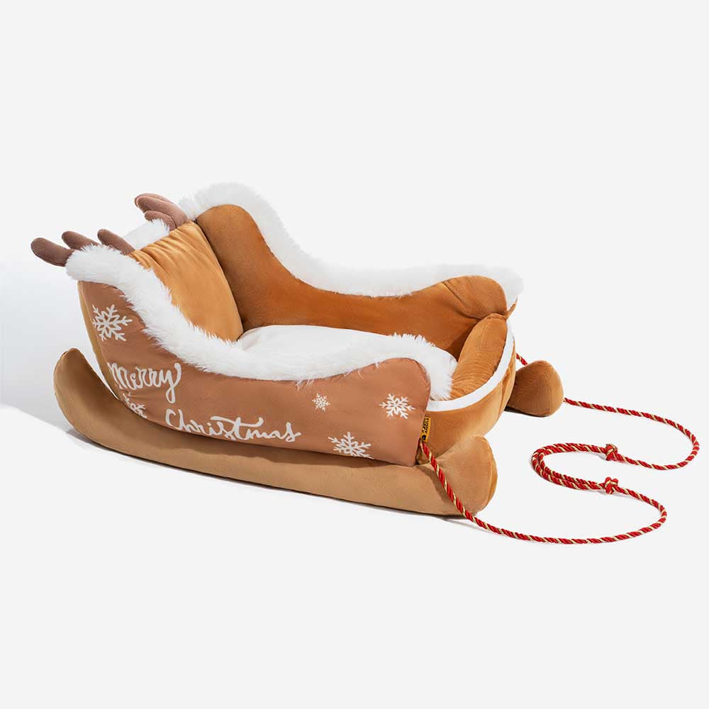 Weiches Plüsch-Hundebett in Weihnachtsschlittenform. Gemütlicher Rückzugsort für Ihr Haustier.
