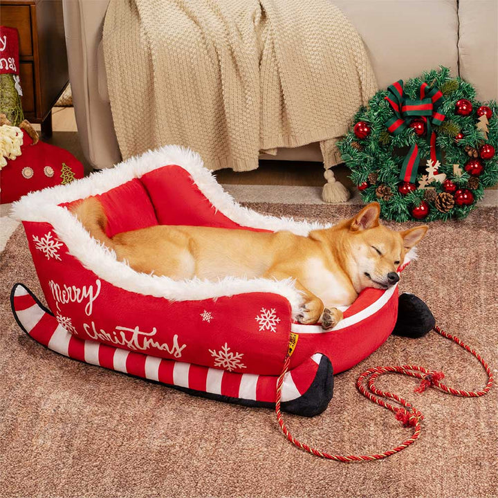 Luxuriöses Plüsch-Hundebett, als Weihnachtsschlitten gestaltet. Perfektes festliches Winter-Accessoire.