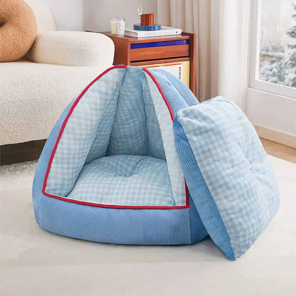 Blaues Kuschelbett für Haustiere, wandelbar von Höhle zu offenem Bett, komfortabel und pflegeleicht.