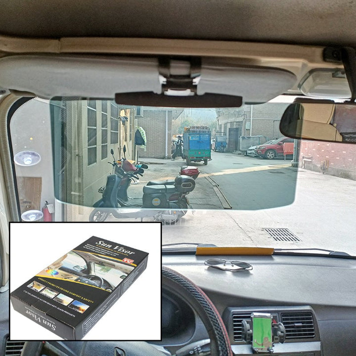 Befestigte graue Autosonnenblende im Fahrzeug, bietet polarisierten Blendschutz und Fahrkomfort.