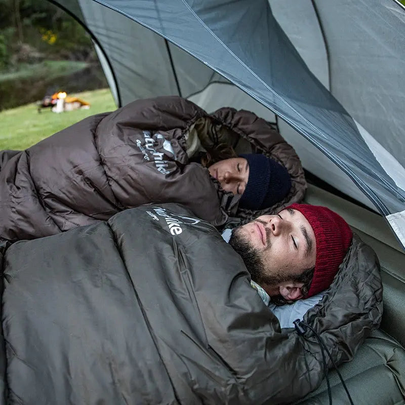 Wärmender Mumienschlafsack aus Polyester in Grau/Grün; ideal für Outdoor-Camping & Wandern bei kaltem Wetter.