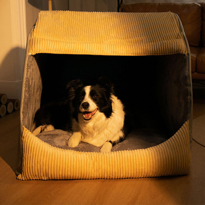 Graues Hundebett aus Flanell, groß. Halbgeschlossener Kuschelplatz, ideal für warme Nickerchen.