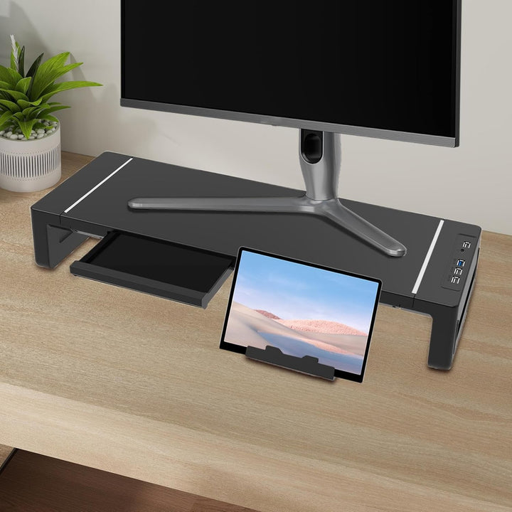 Büro-Monitorständer mit Schublade für Dokumente & USB-Ports für Tastatur, Maus & Smartphone am Schreibtisch.