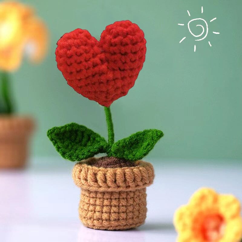 Zeitlose Schönheit: handgefertigte Strickblumen für eine charmante, florale Raumgestaltung.