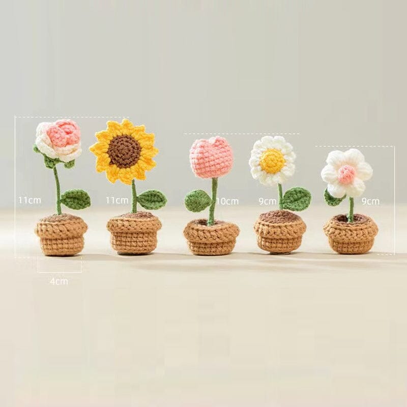 Arrangement ewiger Blüten: Handgestrickte Blumen, umweltfreundlich & pflegeleicht.