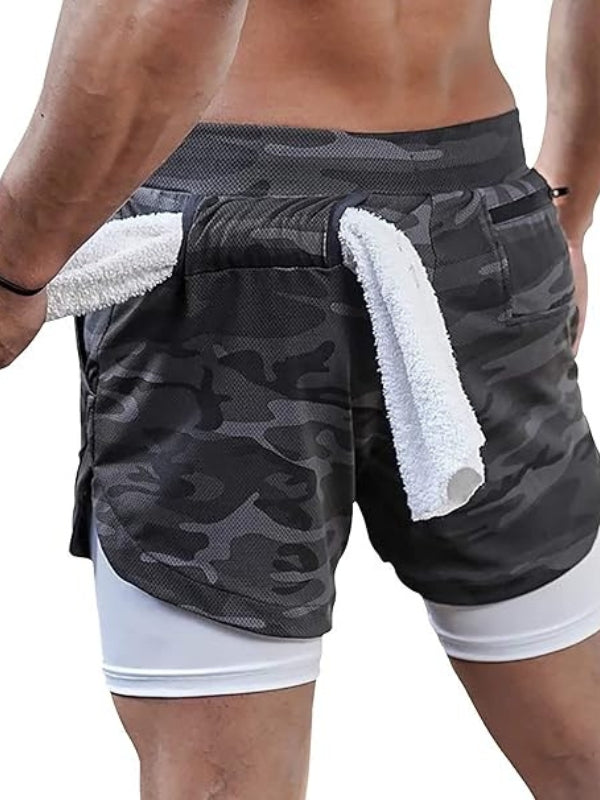 Stapel von Herren 2-in-1 Sportshorts in verschiedenen Farben, Auswahl für Sommer-Athleisure.