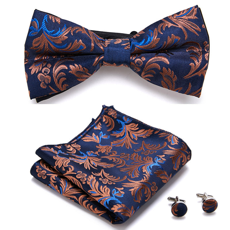 Herren Accessoire-Set mit floraler Fliege, Einstecktuch & Manschettenknöpfen. Edles Design, hohe Qualität.