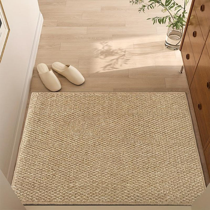 Moderne Fußmatte in Jute-Optik aus Polypropylen, waschbar & rutschfest für stilvolle Eingänge.