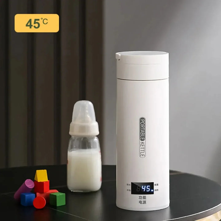 Robuster Reisebegleiter: Edelstahl Mini-Wasserkocher mit präzisem LCD-Display für Heißgetränke auf Reisen.