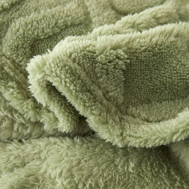 Luxuriös weiche Lammwolldecke mit flauschiger Oberfläche, ideal als kuschelige Wohndecke oder Schlafzimmerdecke.