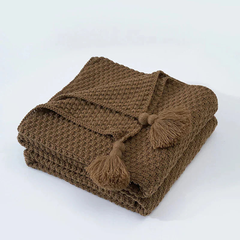 Vielseitige Wolldecke mit Quasten, perfekt als Kuscheldecke, Bettüberwurf oder Wohnzimmerdecke.