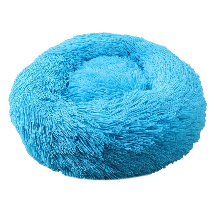 Graues, rundes Donut Kuschelbett für Hunde. Extraweicher Plüsch für optimalen Tiefschlaf.