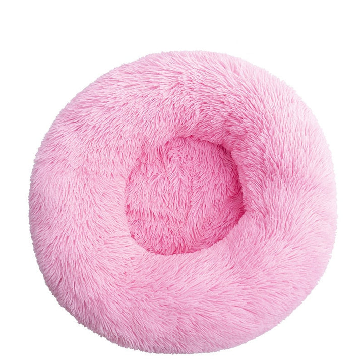 Beiges Donut Welpenbett, besonders weich und angstlösend. Perfekt für Komfort und Entspannung.