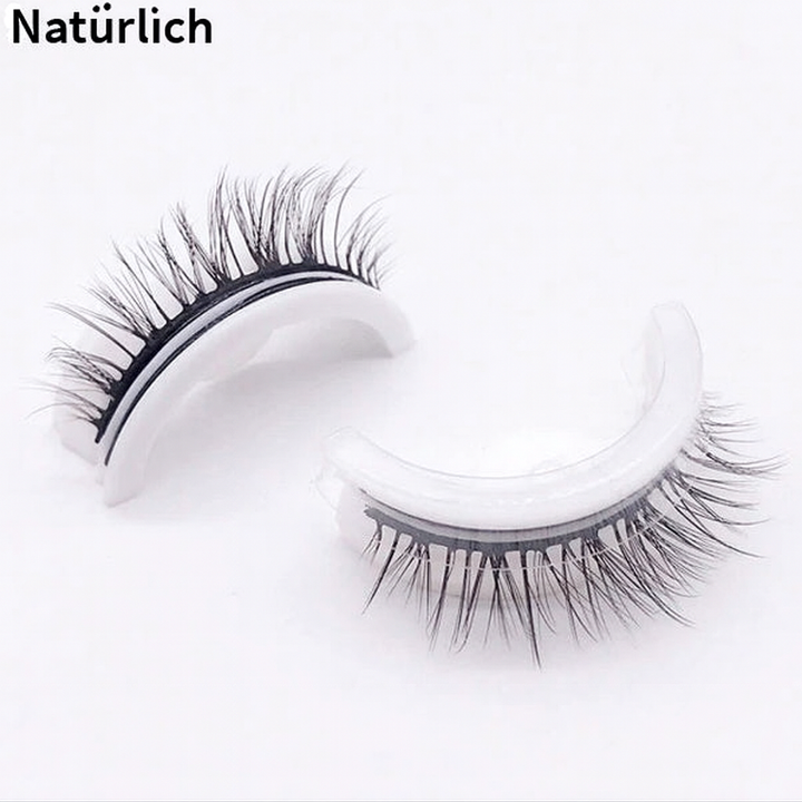 Model trägt LashLure Duo Wimpern für voluminöse, falsche Wimpern. Perfekt für einen dramatischen Augenaufschlag.