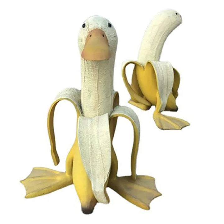 Gelbe Bananenente "Quaki" Gartenskulptur mit Entenkopf. Eine lustige, wetterfeste Figur für Ihre Außendeko.