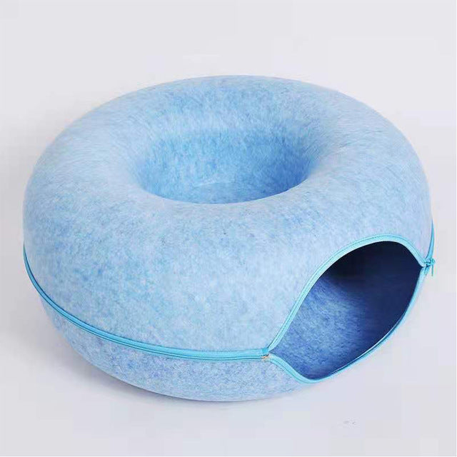 WhiskerNest Donutbett für Katzen, weich und warm, bietet den perfekten Rückzugsort für Ihr Haustier.