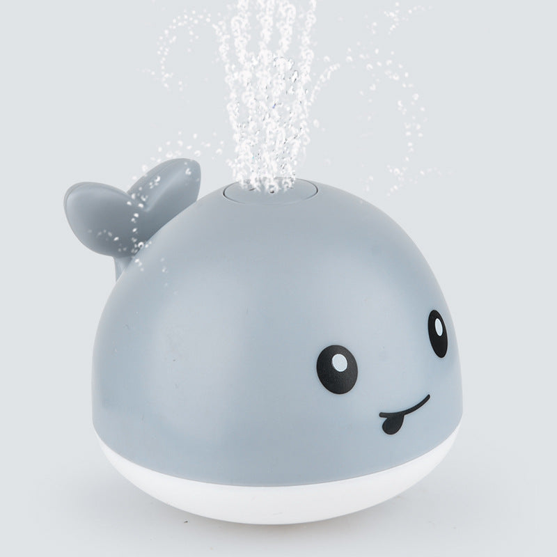 Robustes Wal Badespielzeug aus Kunststoff mit Wassersprühfunktion, sicher für Babys & Kinder.