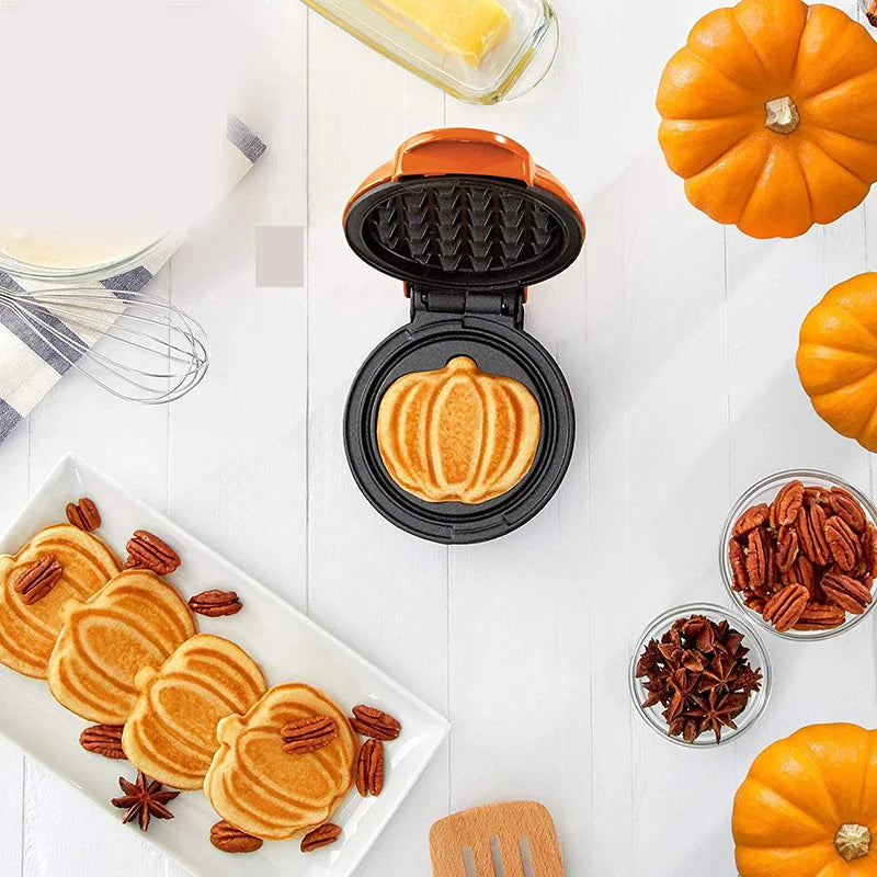 Modernes Mini Waffeleisen für schnelle Snacks. Dieses elektrische Küchengerät ist kompakt und ideal für jeden Haushalt.