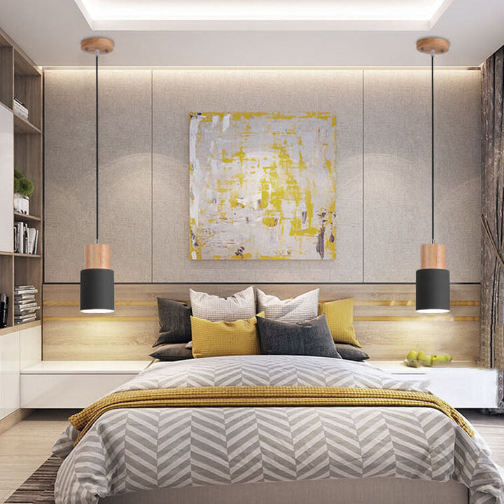 Moderne LED-Hängeleuchte mit Zylinderform, perfekt als Blickfang im minimalistischen Wohnzimmer.