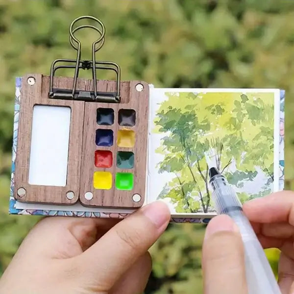 24 leuchtende Aquarellfarben und ein Pinsel im kompakten Malkasten, vielseitiges Kunstzubehör.