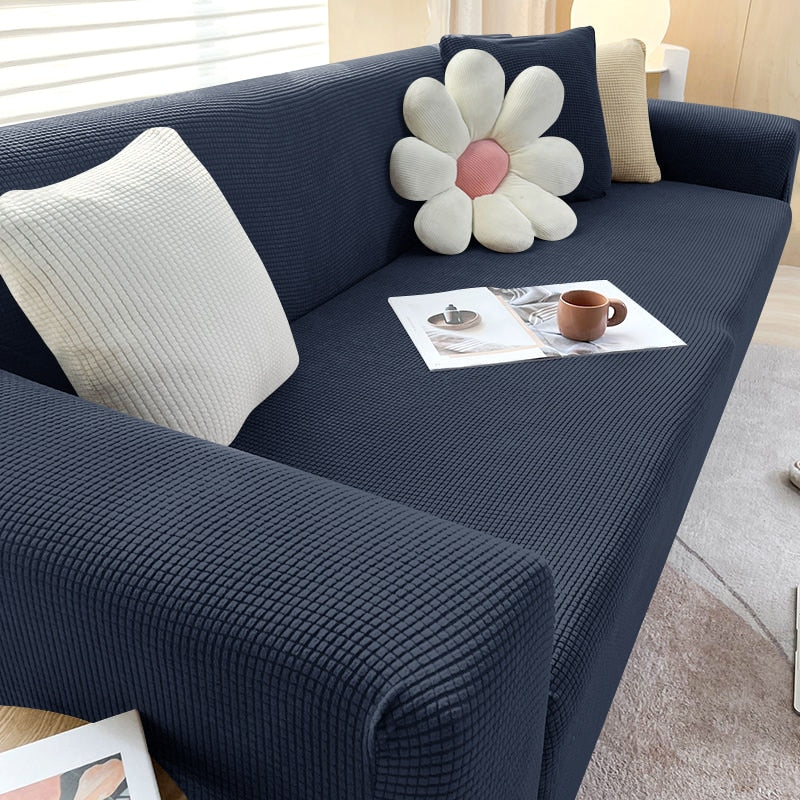 Hochwertige Stretchhusse für Sofa, langlebig, familienfreundlich, in verschiedenen Farben erhältlich.