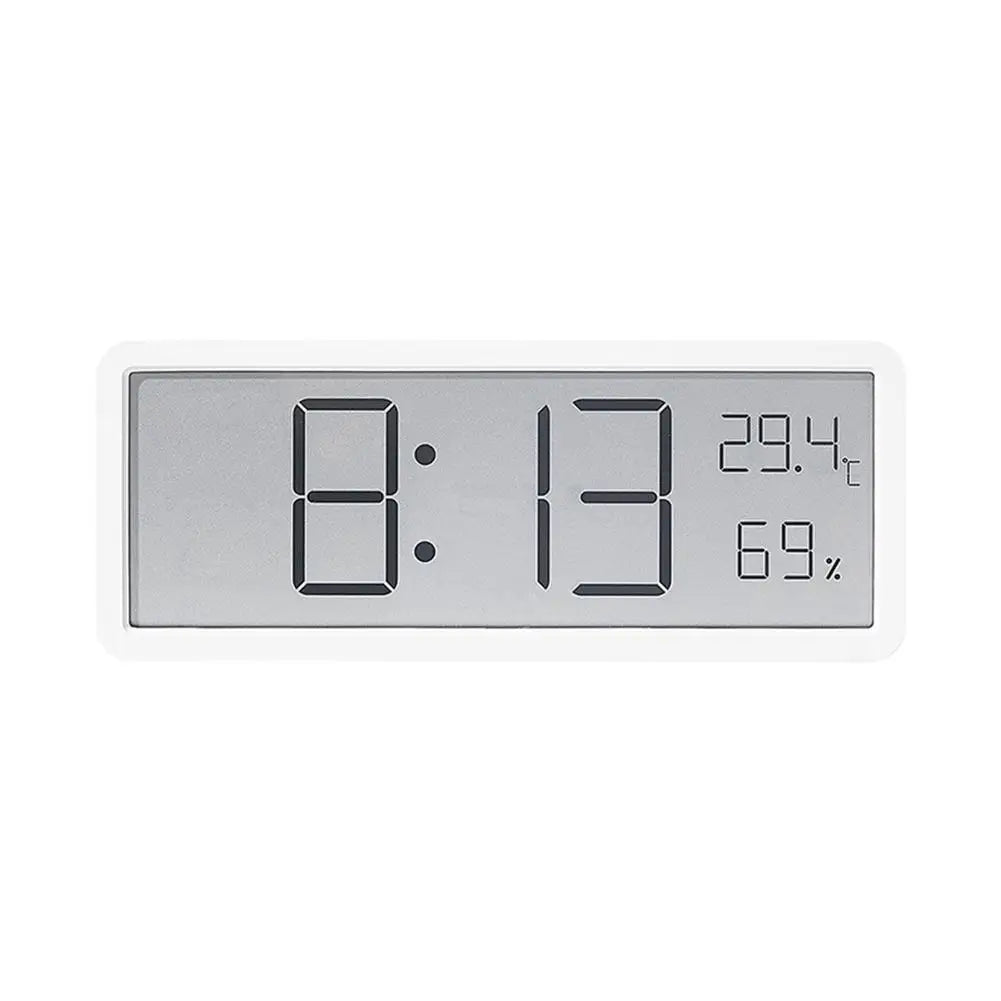 Geräuschlose digitale Wanduhr TimeGlow. Zeigt Zeit, Temperatur, Luftfeuchtigkeit mit großen, gut lesbaren Ziffern.