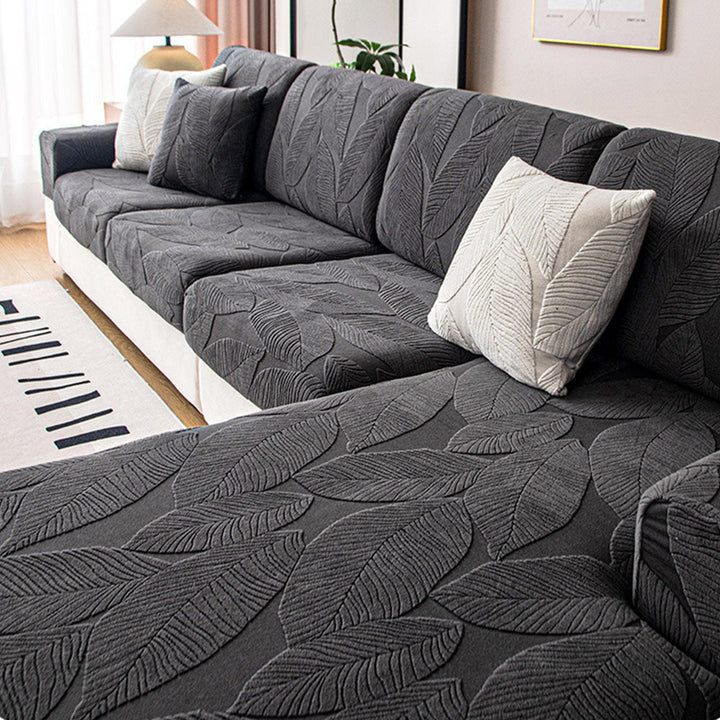 Stilvoller Sofabezug mit Blätterdesign. Wasserabweisend & kratzfest. Idealer Schutz für Ihre Couch.