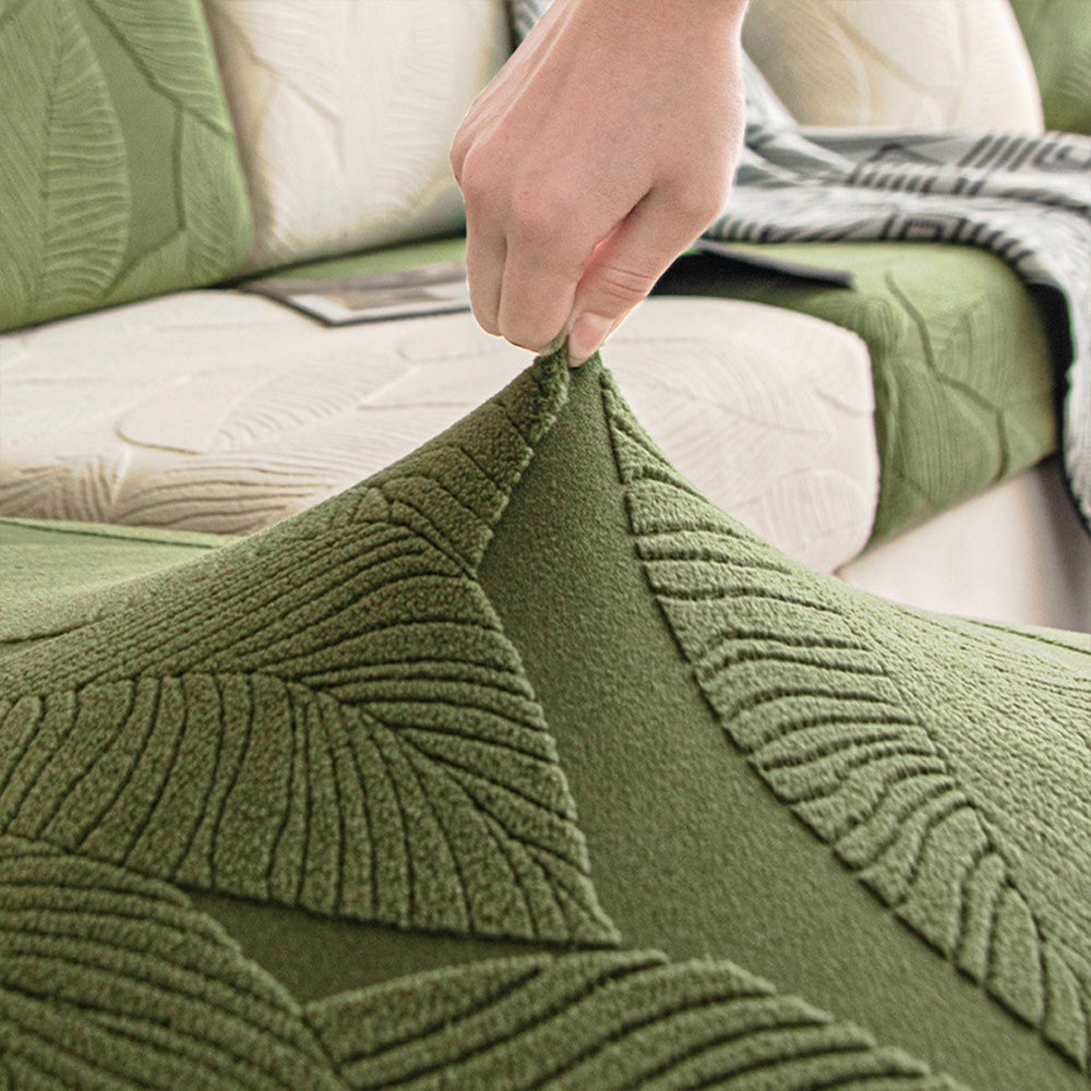 Elastischer Sofaüberwurf mit Blätterdesign. Wasserabweisender & pflegeleichter Schutz für Ihre Couch.