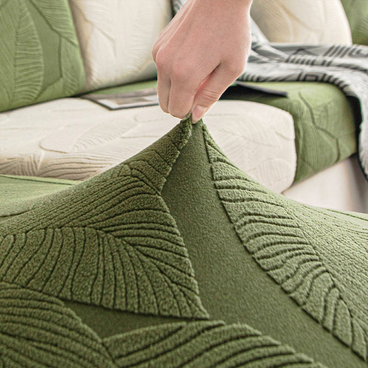 Elastischer Sofaüberwurf mit Blätterdesign. Wasserabweisender & pflegeleichter Schutz für Ihre Couch.