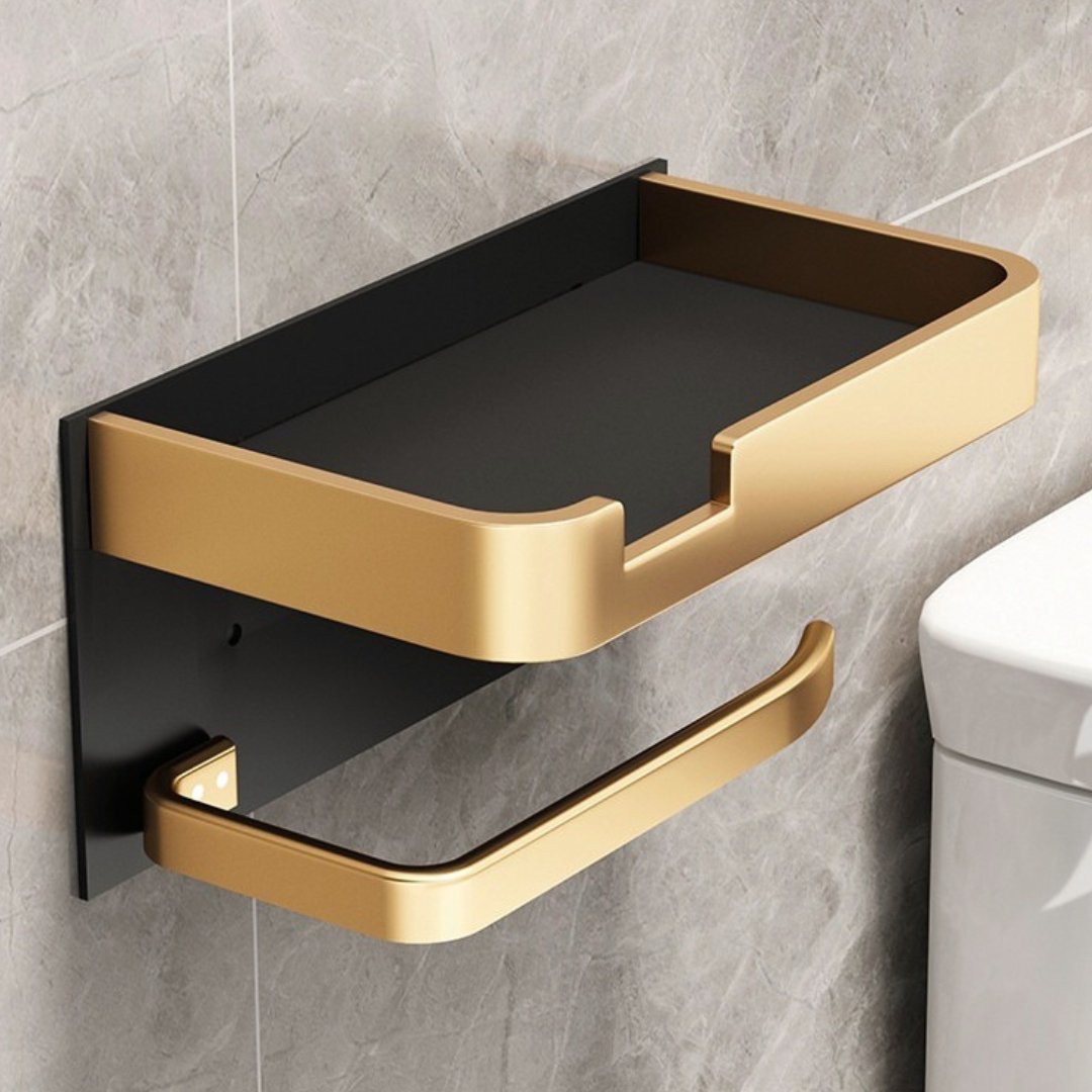 Eleganter goldener Toilettenpapierhalter mit Ablage aus Metall, wandmontiert, für stilvolle Badezimmerorganisation.