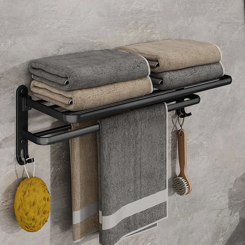 Modernes, faltbares Handtuchregal in Mattschwarz zur Wandmontage im Badezimmer, platzsparend und elegant.
