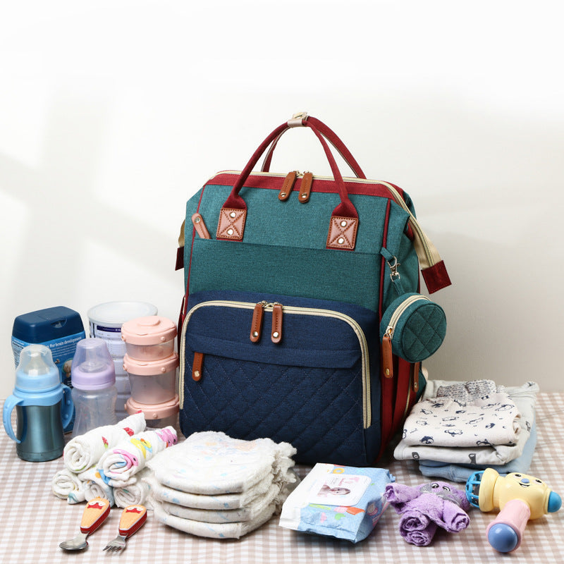 Multifunktionaler Baby Rucksack mit Wickelbett; ideal für Elternalltag & Reisen.