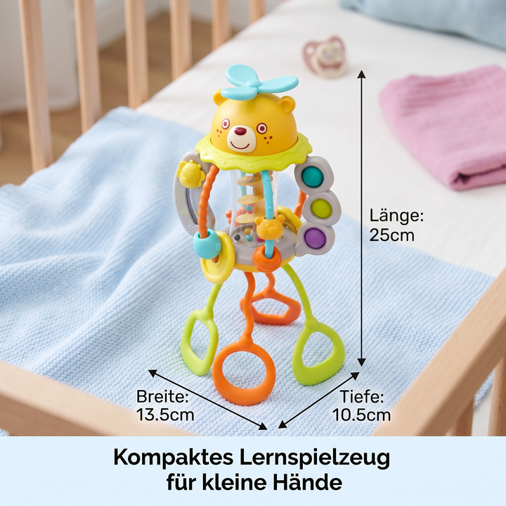 Bunte Baby-Rassel auf Rädern mit Schnur zum Ziehen. Ein interaktives Lernspielzeug, fördert sensorische Fähigkeiten.