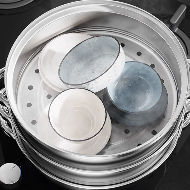 Eleganter NutriSteam Edelstahl-Dampfgarer, 3-Schichten, modernes Küchengerät für gesundes Dampfgaren.