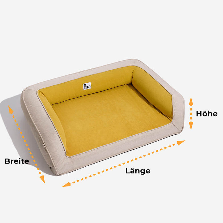 Hund spielt auf seinem robusten, langlebigen orthopädischen Hundebett.