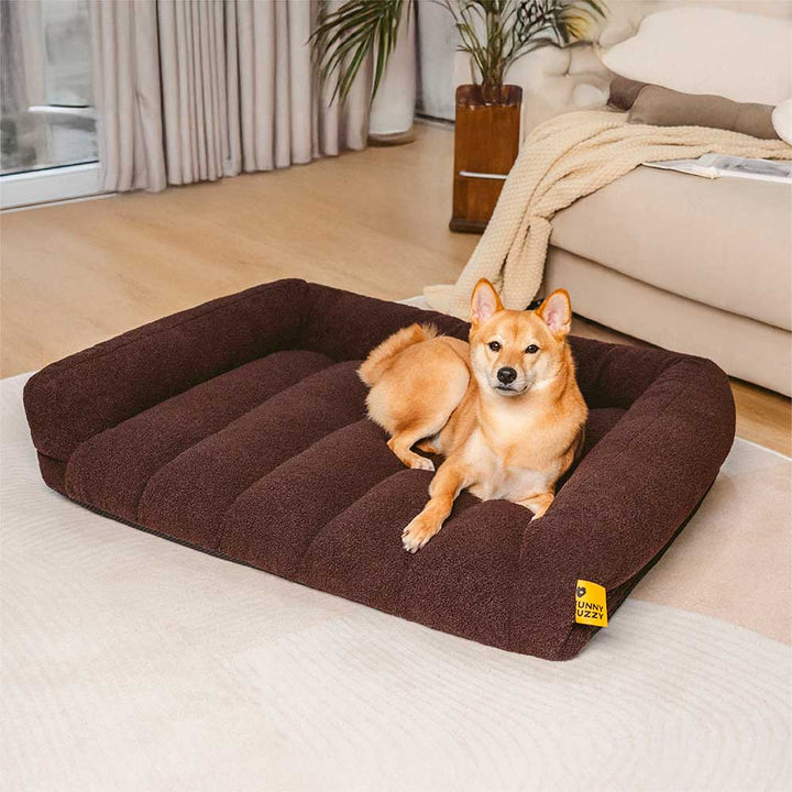 Orthopädisches Haustierbett in modernem Design mit bequemer Kopfstütze und weichem Teddyfleece-Bezug.