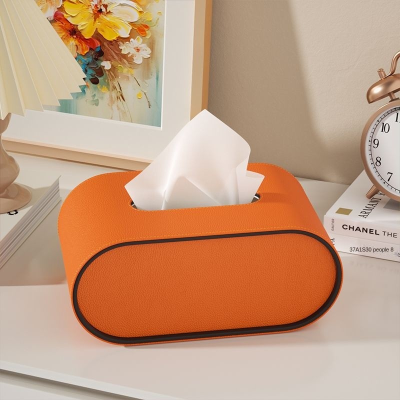 Ovale Leder Taschentuchbox in elegantem Creme-Beige, stilvolles Wohnaccessoire für Zuhause & Büro-Organisation.