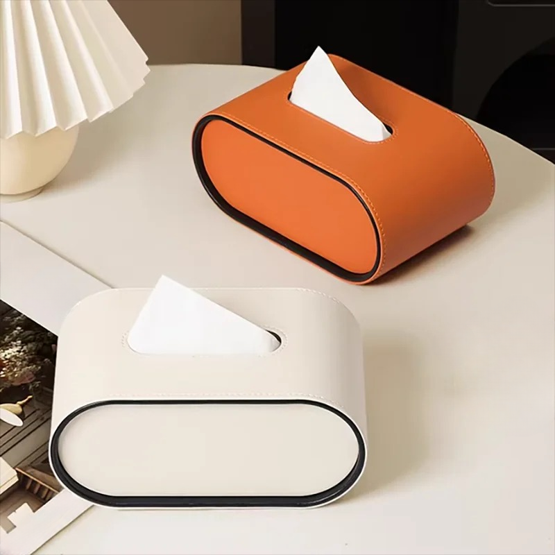 Moderne ovale Taschentuchbox aus Leder in Grau, stilvolles Deko-Objekt und praktische Organisation für jeden Raum.