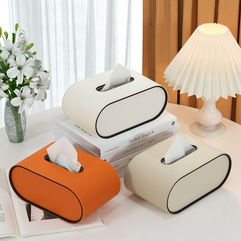 Auffällige ovale Leder Taschentuchbox in leuchtendem Orange, funktionales & stilvolles Wohnaccessoire für Ihr Heim.