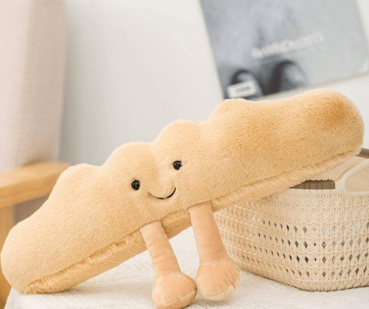 Authentisches Croissant Plüschkissen, ideal als Dekoration. Ein gemütliches Bäckerei Kissen für Ihr Sofa.